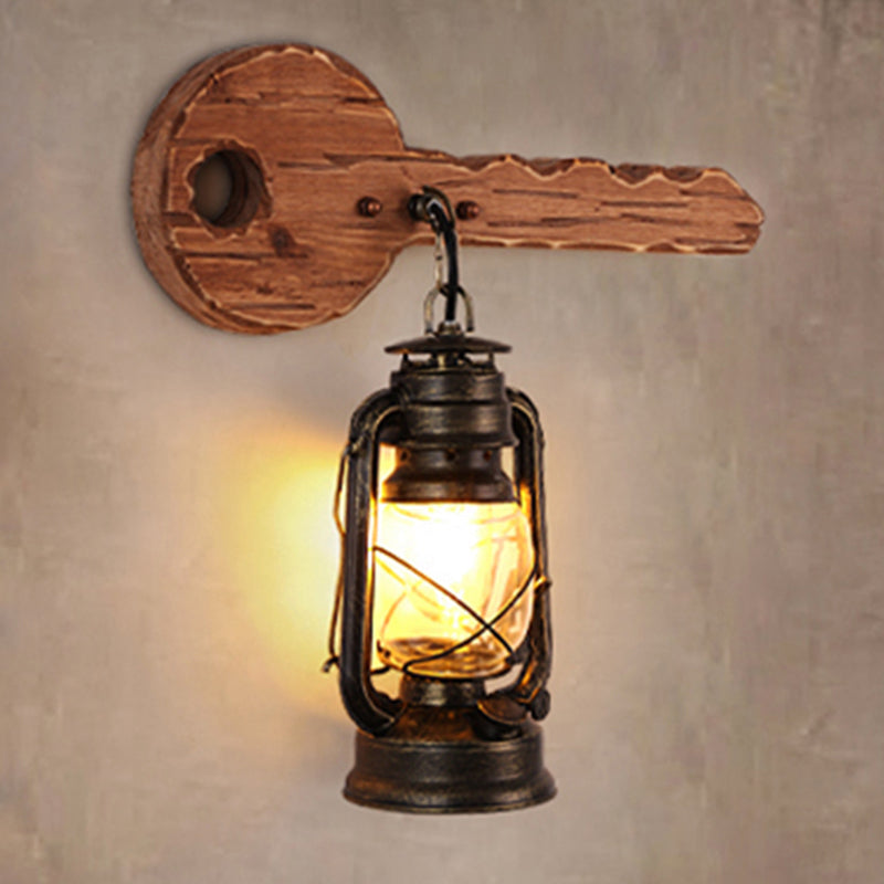 Kerosene Dining Room Wall Lighting Fixture Antiqued Clear Glass 1-Head Brown Sconce with Wood Leaf/Key Backplate