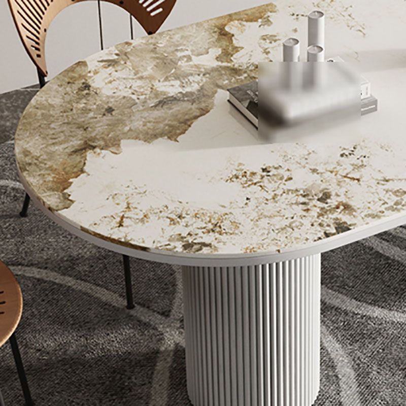 Table de salle à manger ovale moderne avec dessus en pierre et double piédestal en métal