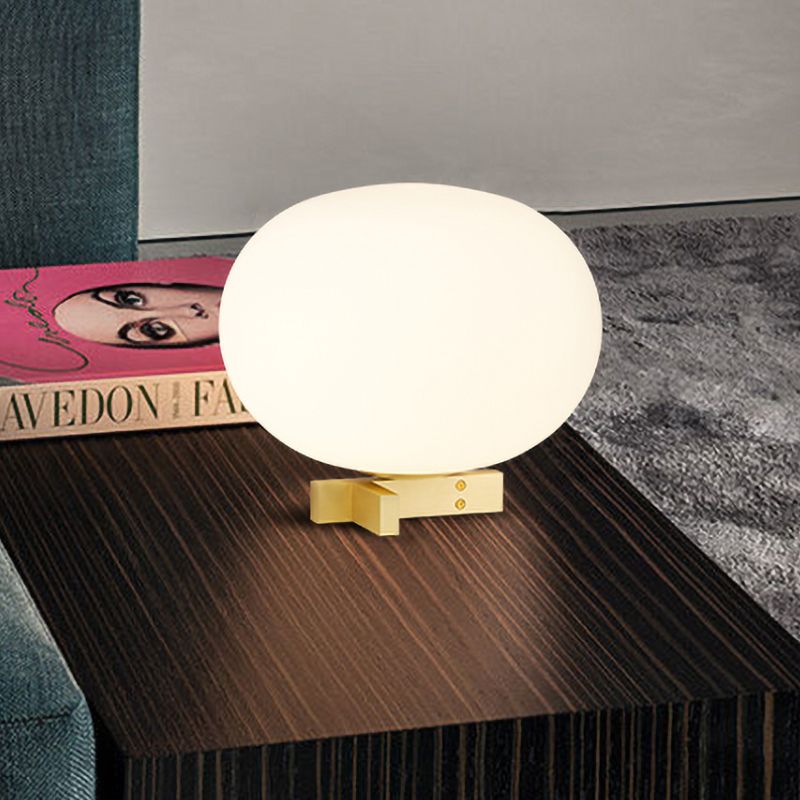 Lampada da notte postmoderna a forma di uovo in vetro color crema Lampada da comodino con finitura oro a 1 luce per comodino