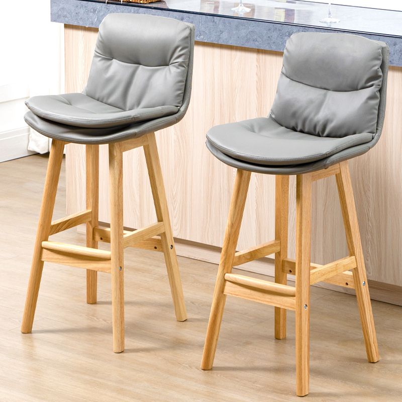 Taburete de bar de cuero con respaldo bajo, moderno taburete de interior con patas de madera