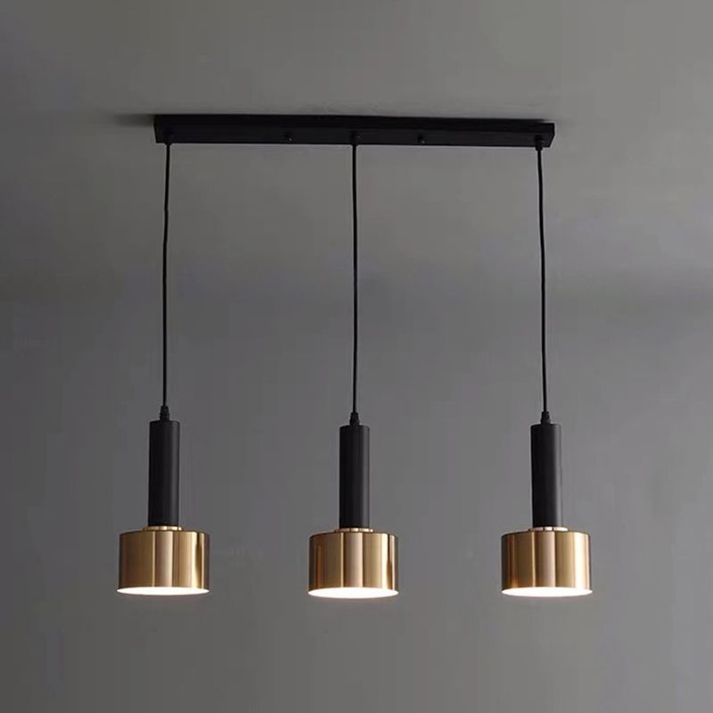 Luce a sospensione in cilindroide nera e oro in ferro battuto in ferro di lusso moderno
