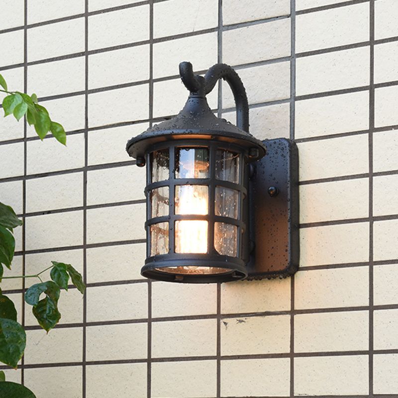 Geplaatste glazen lantaarn wandlamp platteland een lichte buitenmuurlicht in brons/zwart