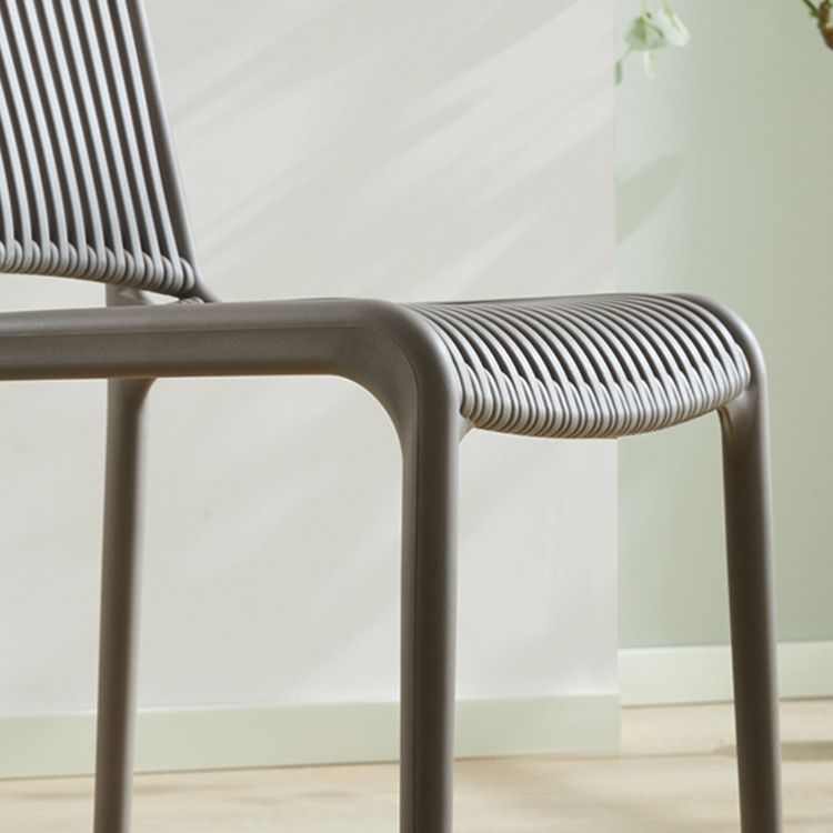Silla de comedor sin brazos apilable escandinava, silla lateral con respaldo de listón de plástico