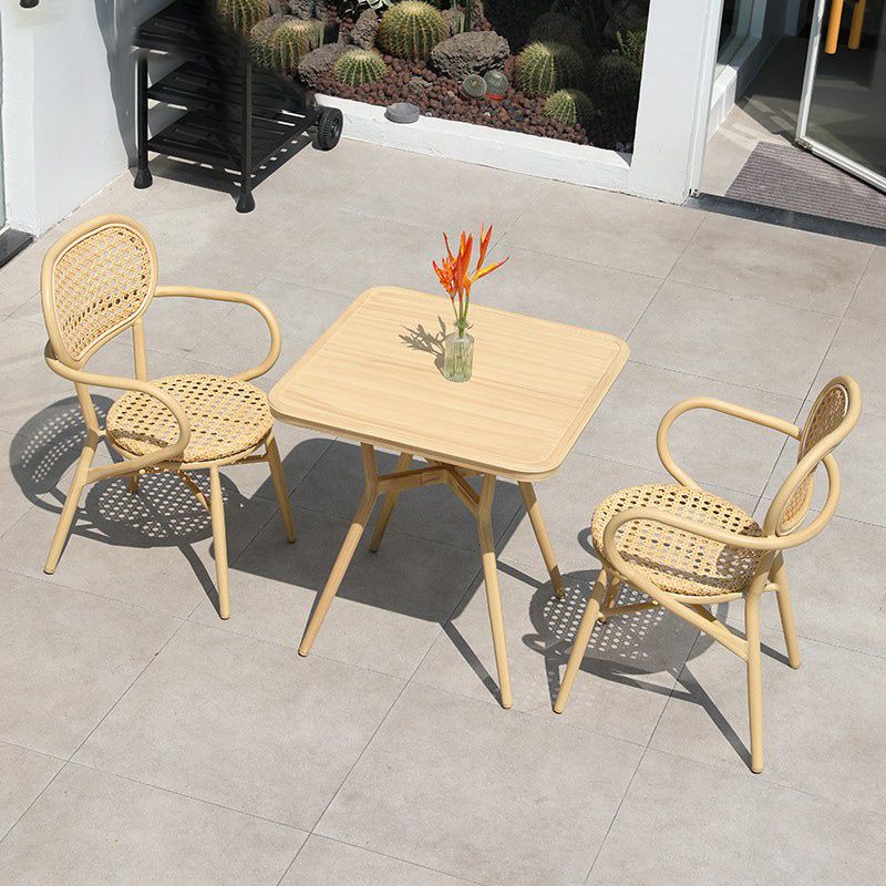Contemporary Natural Patio Dining Side Chair with Faux Rattan Back