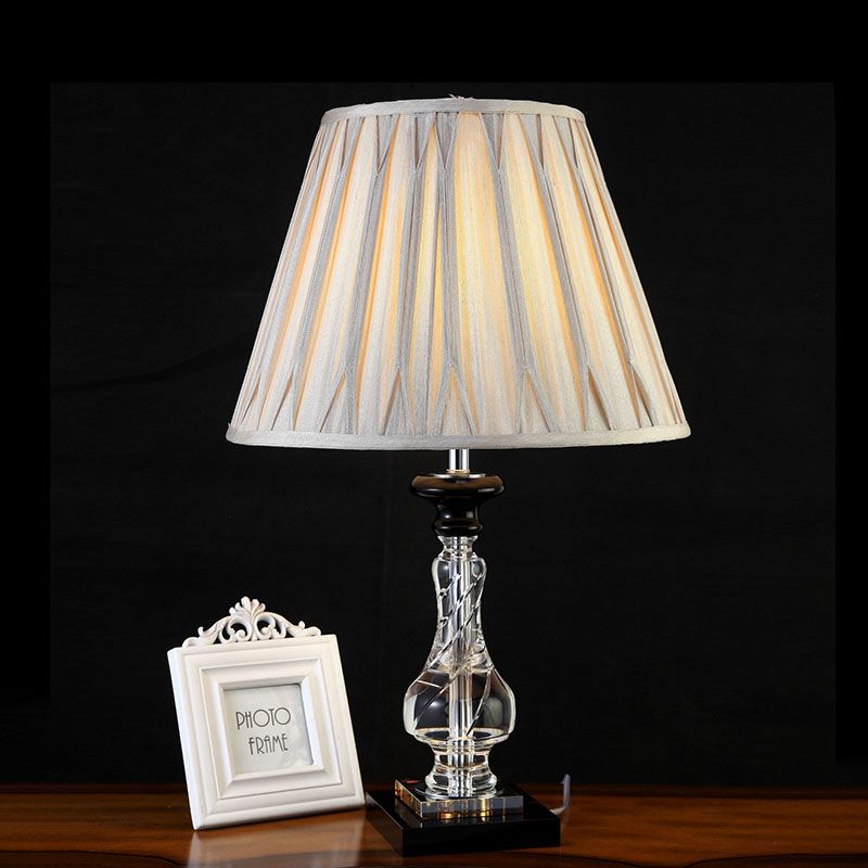 Lámpara de mesita de noche Minimalism Bell, 1 luz nocturna de tela ligera en gris crema con base de cristal translúcido