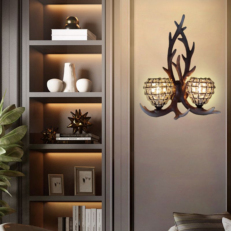 Resin Antler Wall Lighting Country 2-Light Bedroom Sconce Light Fixture in Brown/Gold with Globe Crystal Shade