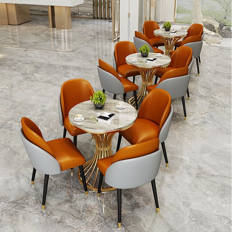 Eenvoudige stijl thuis gesinterde stenen eettafel ronde vormtafel met metalen voetstukbasis