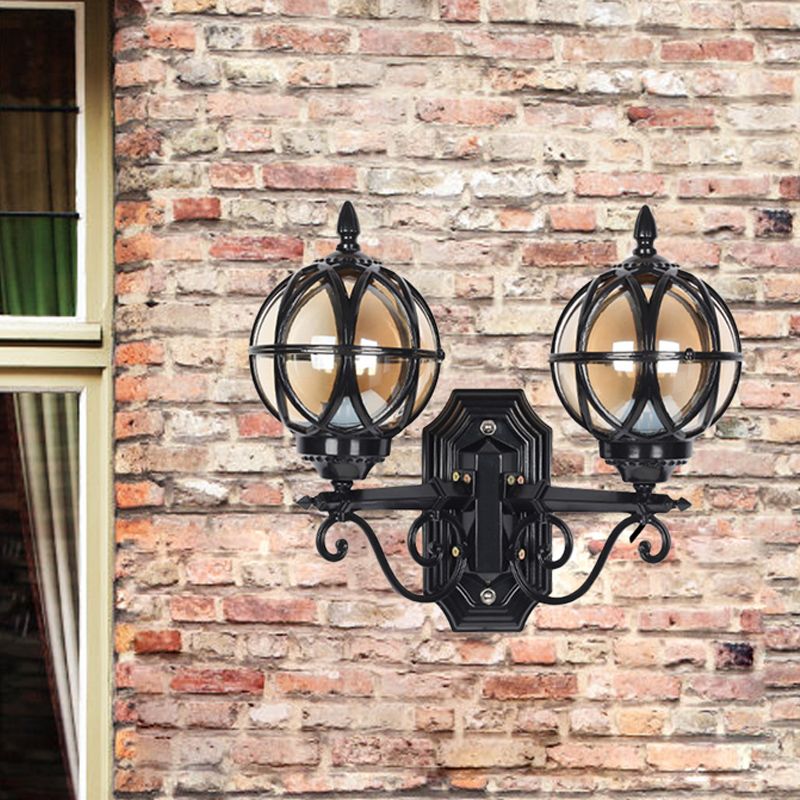 Black/Bronze Spherical Wall Lighting Ideas Country Amber Glass 2-Bulb Patio Surface Wall Sconce with Cage