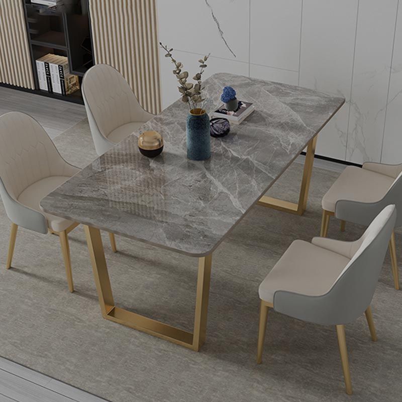 Mesa de cocina rectangular de lujo con superficie de piedra sinterizada y pedestal doble en dorado