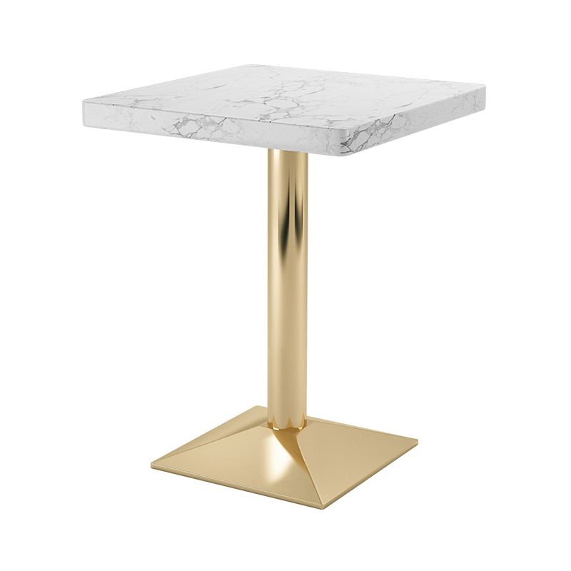 Mesa de comedor industrial de madera maciza con base de pedestal de metal