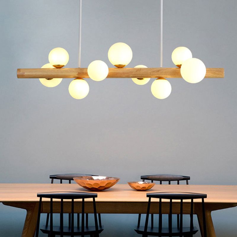 Luces colgantes de restaurantes de múltiples cabezas de madera moderna con sombra de vidrio de globo