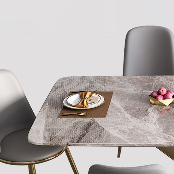 Mesa de comedor de lujo tradicional rectángulo mesa de piedra sinterizada gris con base de pedestal dorado