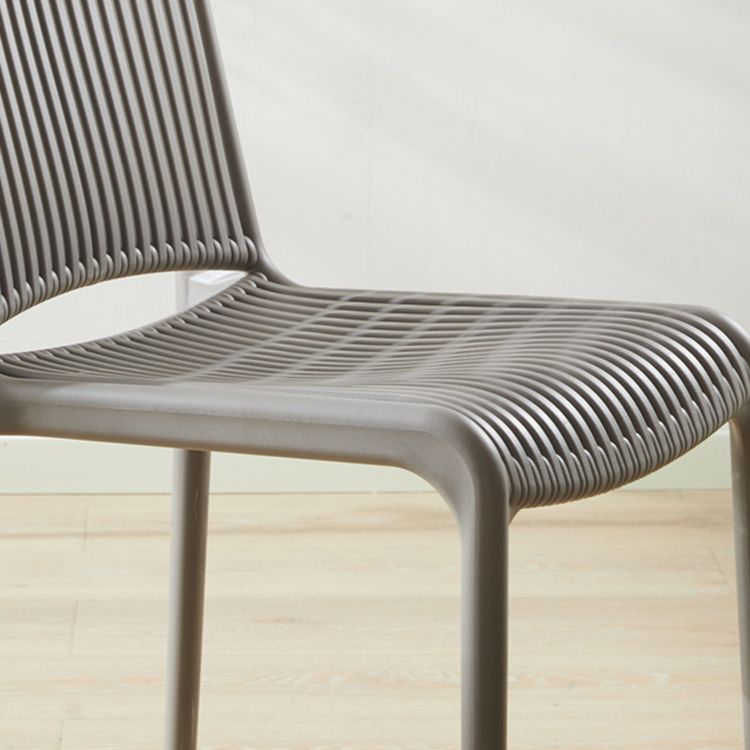 Silla de comedor sin brazos apilable escandinava, silla lateral con respaldo de listón de plástico
