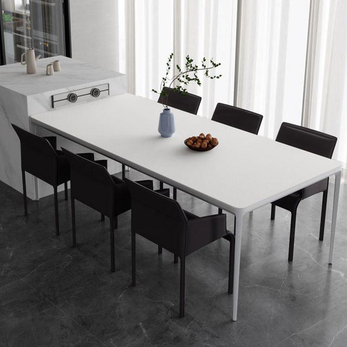 Table à manger rectangulaire contemporaine en métal blanc table de pierre fritrée avec des jambes métalliques