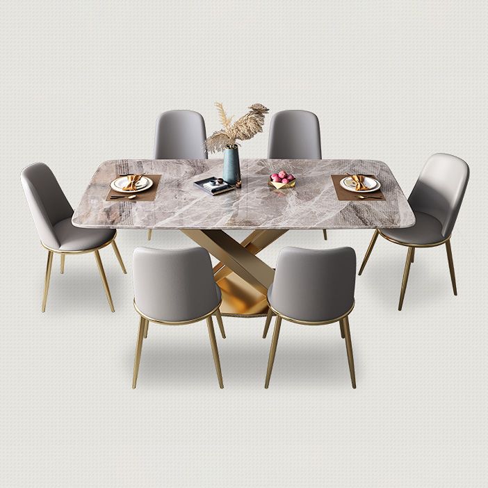 Mesa de comedor de lujo tradicional rectángulo mesa de piedra sinterizada gris con base de pedestal dorado
