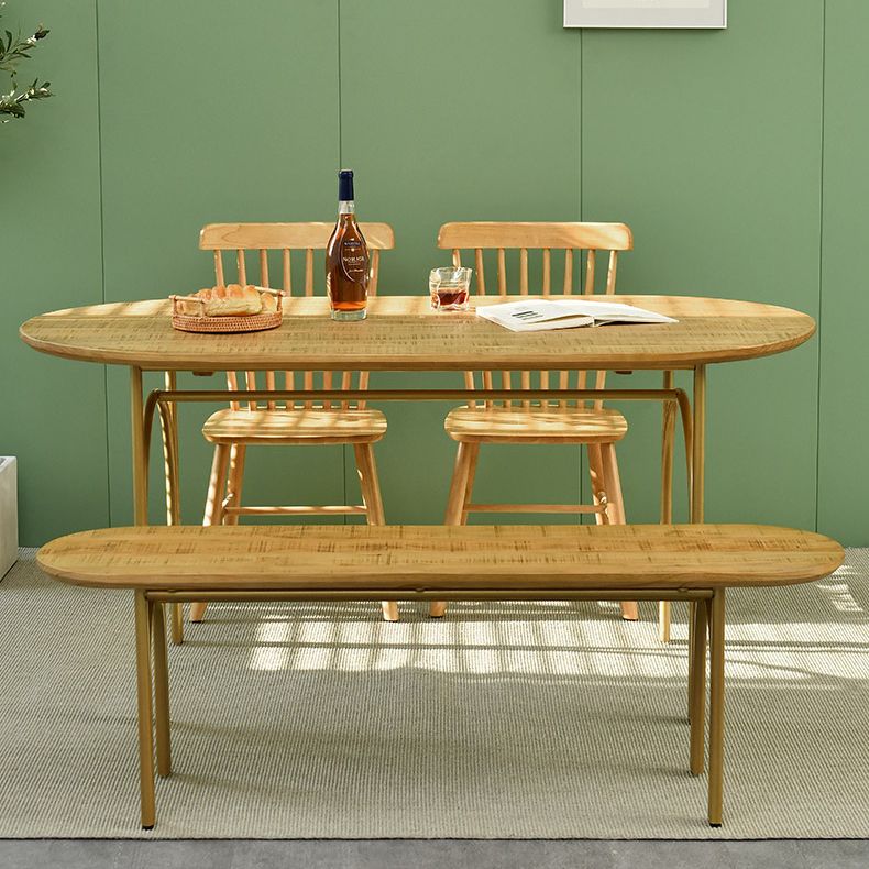 Zeitgenössischer Esstisch ovaler masser Holztisch mit metallischem vierbeinigen Tisch