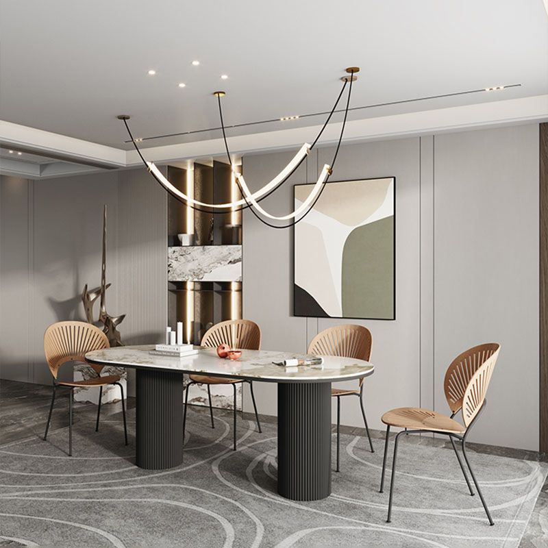 Table de salle à manger ovale moderne avec dessus en pierre et double piédestal en métal