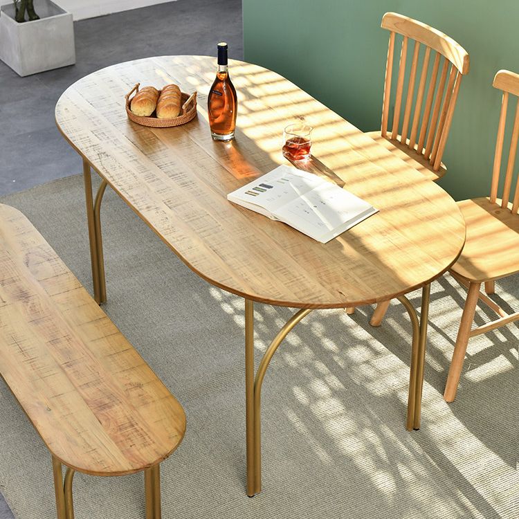 Zeitgenössischer Esstisch ovaler masser Holztisch mit metallischem vierbeinigen Tisch