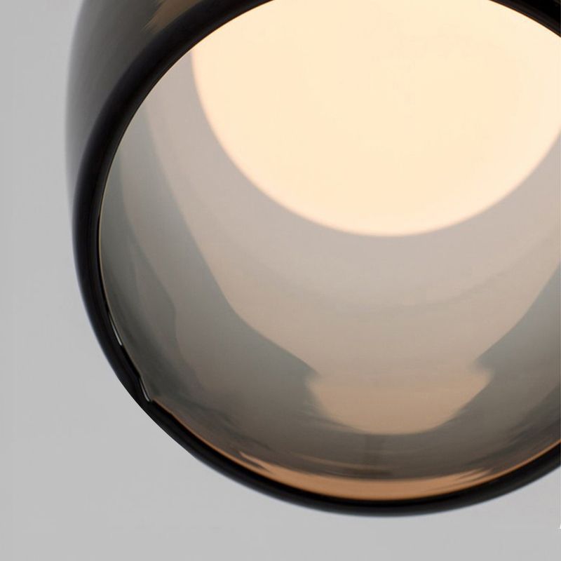 Lampe suspendue à la cloche en verre dans un pendentif en fer forgé moderne pour chambre à coucher