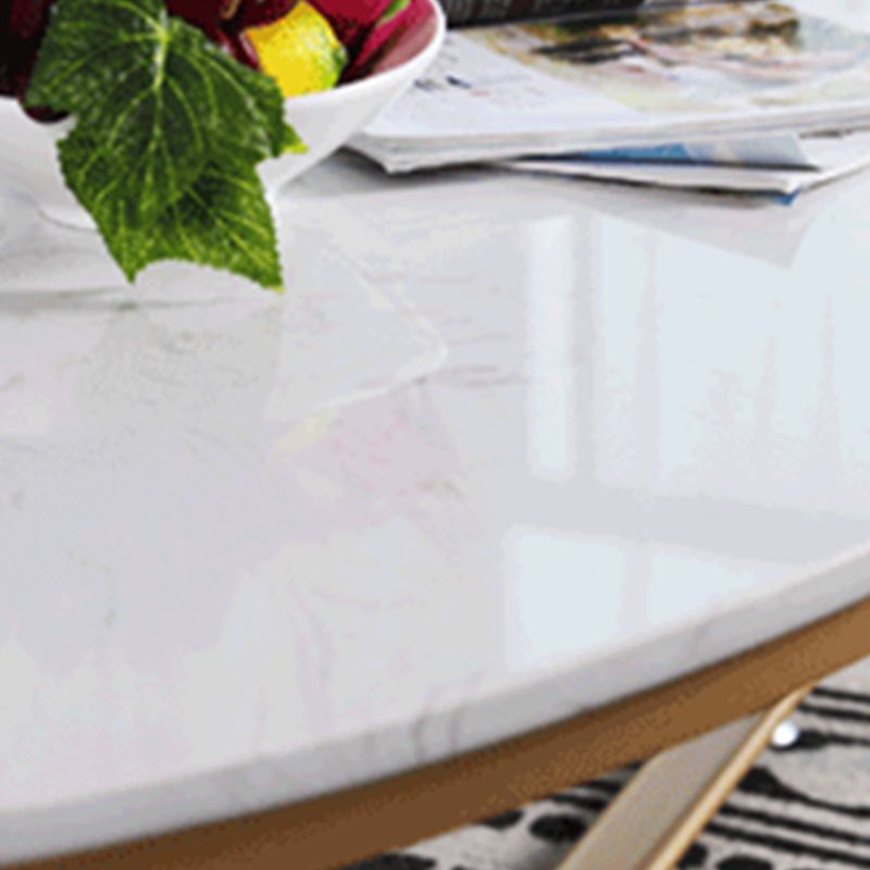 Glam Style Cocktail Table with Oval Top and Golden Iron Cross Base