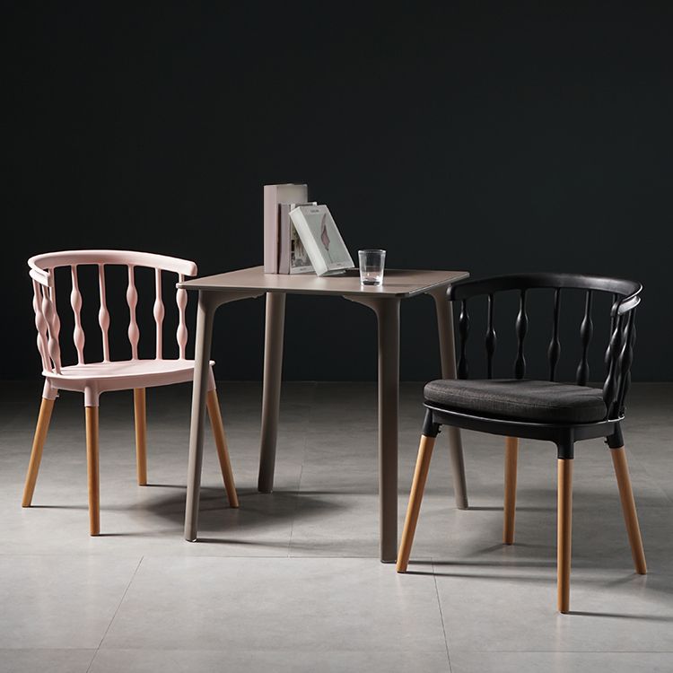 Sillas de comedor estilo moderno Sillas sin brazos de plástico con patas de madera