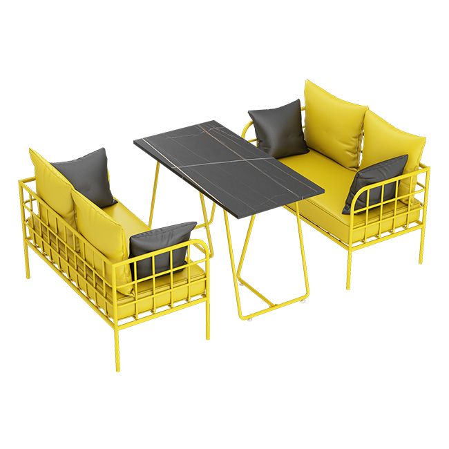 Mesa de cena de piedra sinterizada industrial mesa de mesa negra con marco amarillo para comedor