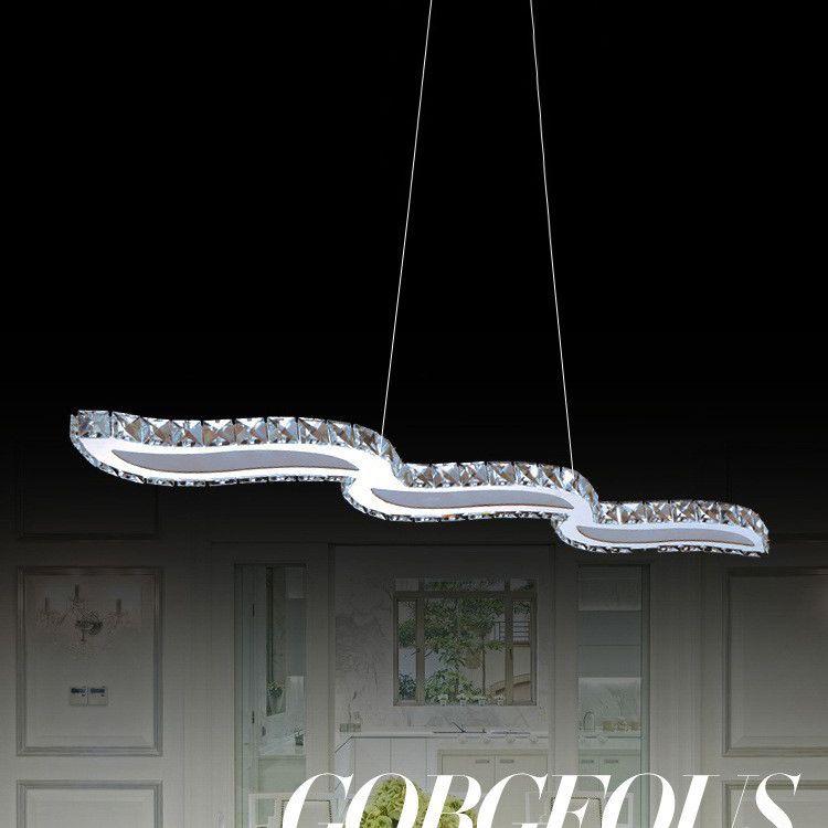 Moderno lussuoso lussuoso isola a pendente illuminazione ondata prismatica a soffitto di cristallo ottico per soggiorno