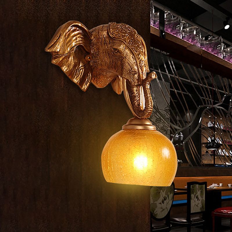 Gold 1-Bulb Wall Lighting Traditional Orb Crackle Frosted Glass Wall Sconce with Resin Elephant Backplate