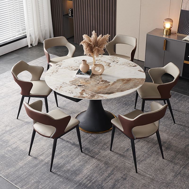 Mesa de comedor de piedra sinterizada de lujo con base de metal negro
