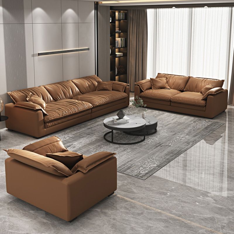 Glam Style Sofa Bed with Sponge Upholstery Filled Orange Faux Leather Sofa