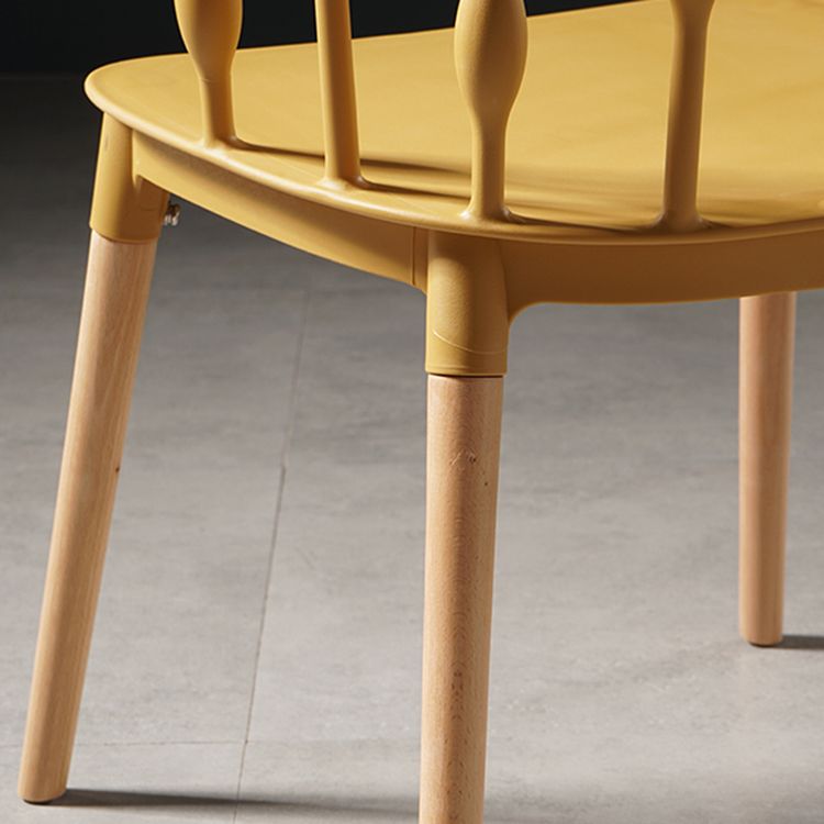 Sillas de comedor estilo moderno Sillas sin brazos de plástico con patas de madera
