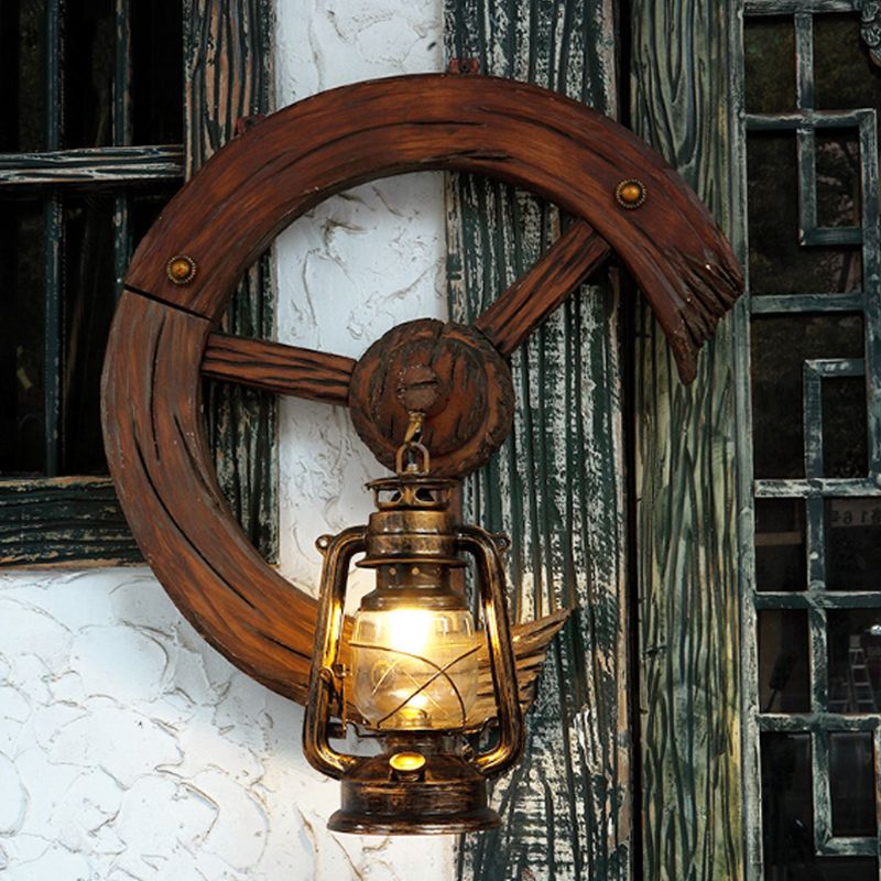 Clear Glass Kerosene Sconce Coastal 1 Light Bedroom Wall Mount Light Fixture in Brass with Wood Backplate