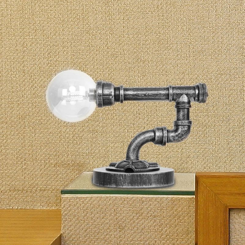 Lampada da lettura a luce singola in argento antico/bronzo. Illuminazione industriale con paralume globo in vetro trasparente/ambrato