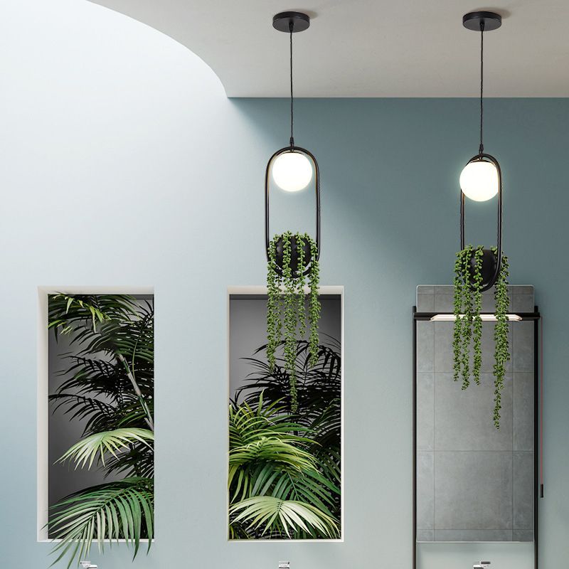 Black 1 Light Spherical Pendant Light Nordic Retro Oval Metal Ring Shade Hanging Lamp with Green Plant