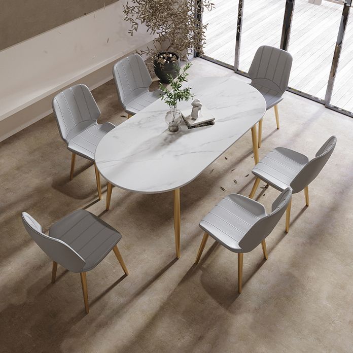 Table à manger ovale contemporaine Table à manger en pierre fritrée avec 4 jambes en métal pour salle à manger