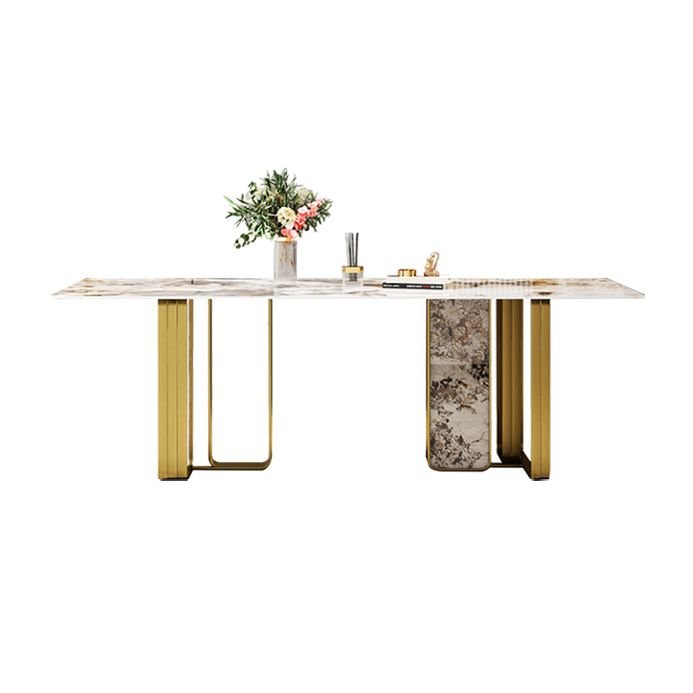 Mesa de comedor rectangular de piedra sinterizada de lujo con pedestal doble dorado