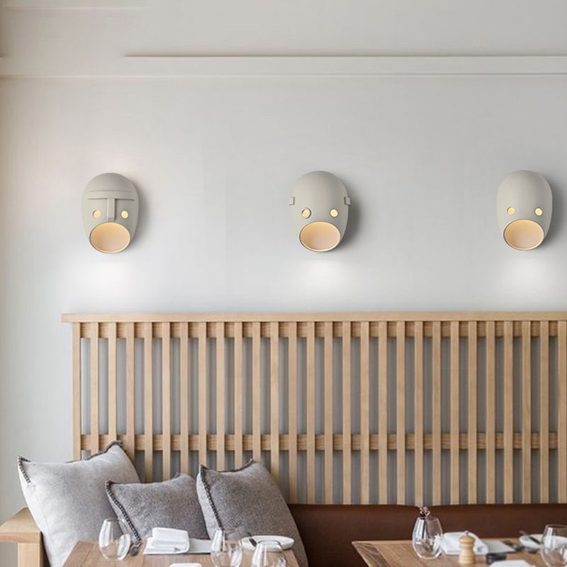 Modern Metal Wall Sconce Mask Shape Wall Light with Resin Shade for Living Room