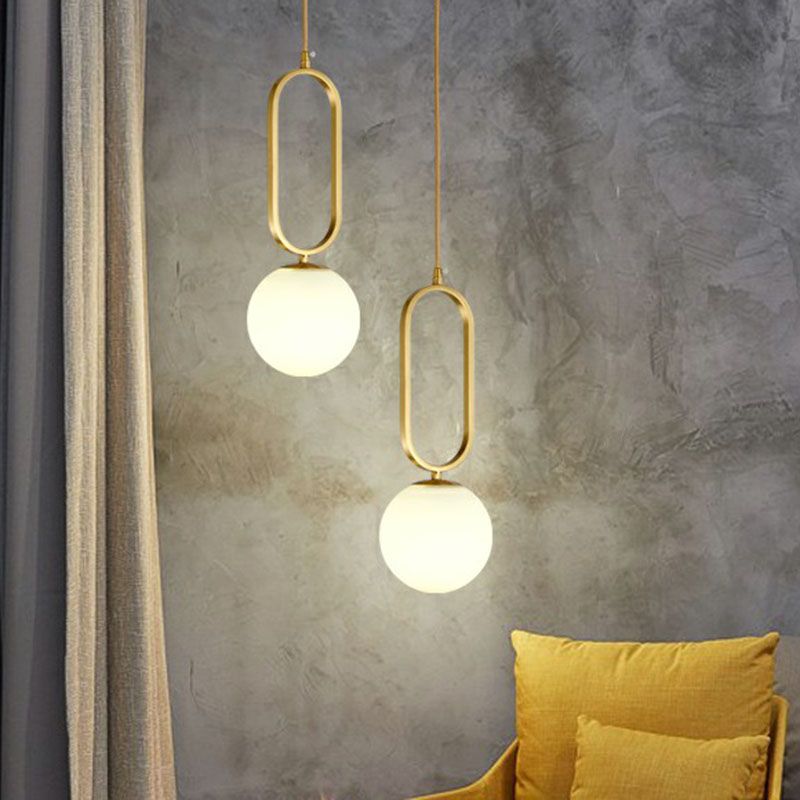 Ball Living Room Suspension Lamp Ivory Glass Single Simple Pendant Light with Oval Ring in Gold