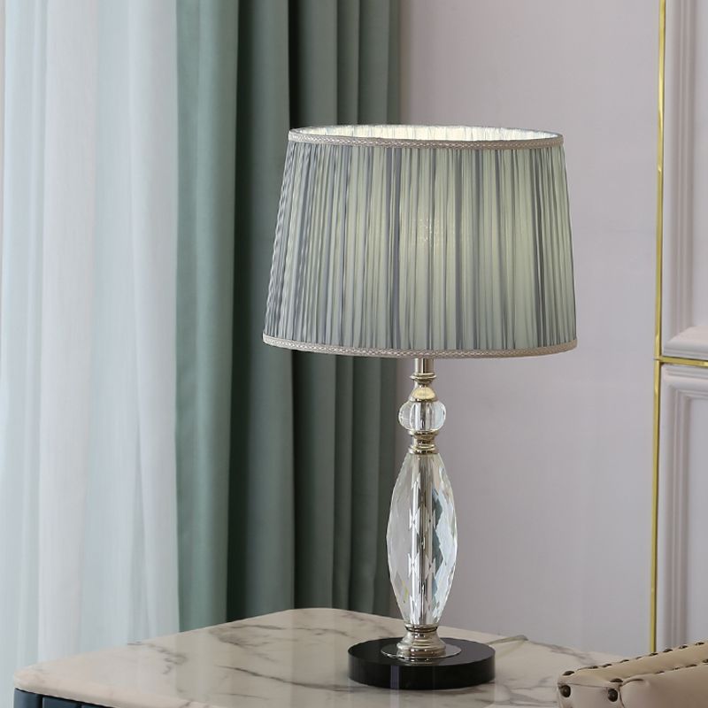 Minimalismo 1 lámpara de escritorio de bulbo con sombra de tela gris/azul de batería de batería con base de cristal transparente para salón