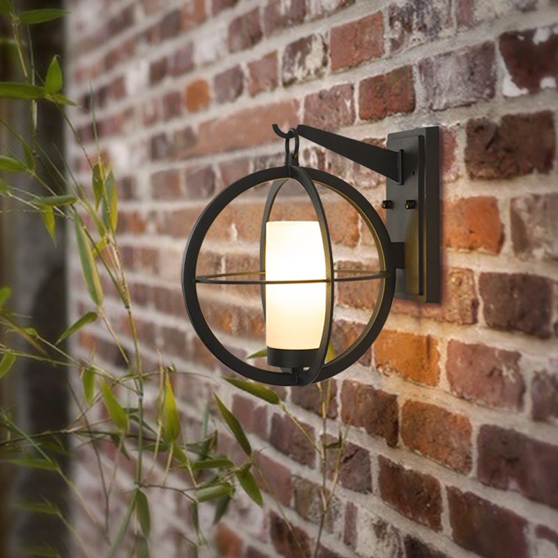 1 Bulb Cylinder Sconce Rural Black Frosted Glass Wall Lighting Fixture with Global Metal Cage
