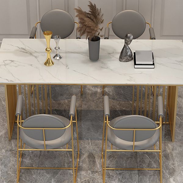 Mesa de comedor de lujo tradicional Mesa de piedra sinterizada con marco de oro para uso en el hogar