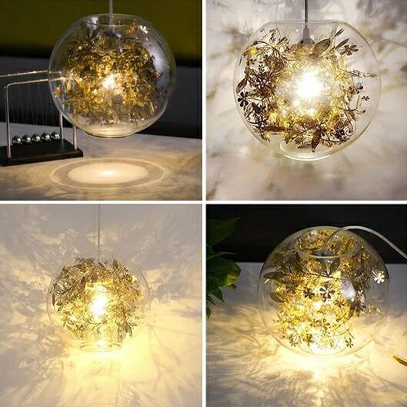 Un capestro a basso globo appeso vetro trasparente moderno ciondolo di illuminazione moderna