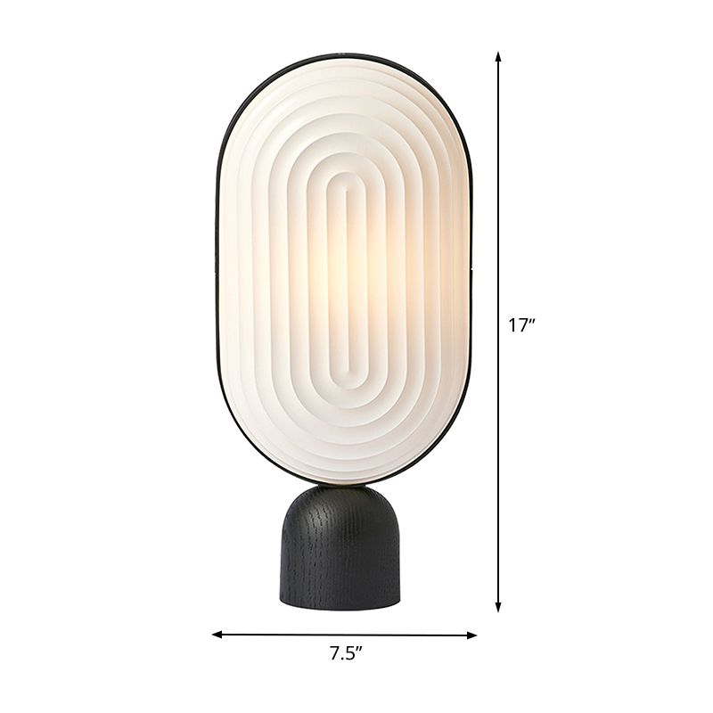 Zeitgenössische LED -Nachttischlampe Weiß längliches Lesebuch Licht mit Harzschatten