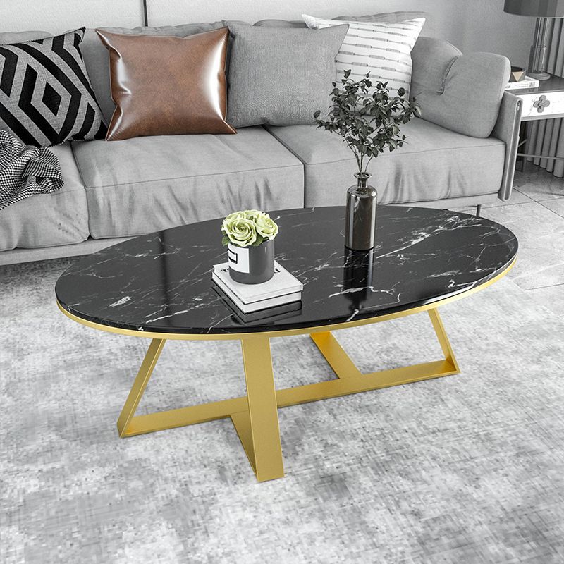 Oval Coffee Table with a Black/gold Base Made of Marble and Wrought Iron