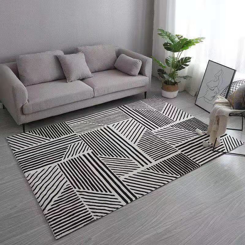 Tapis moderne gris polyester le tapis lavable à franges irréguliers pour décoration intérieure