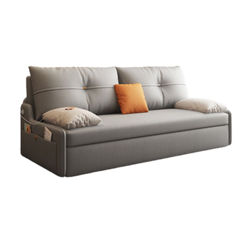Glam Grey Futon Sleeper Sofa with Tufted Back and Storage in Faux Leather