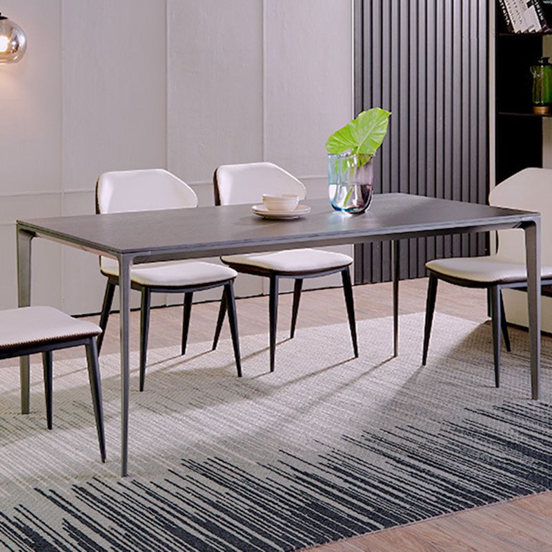 Simplicidad Mesa de comedor de piedra sinterizada Mesa rectangular con cuatro patas metálicas