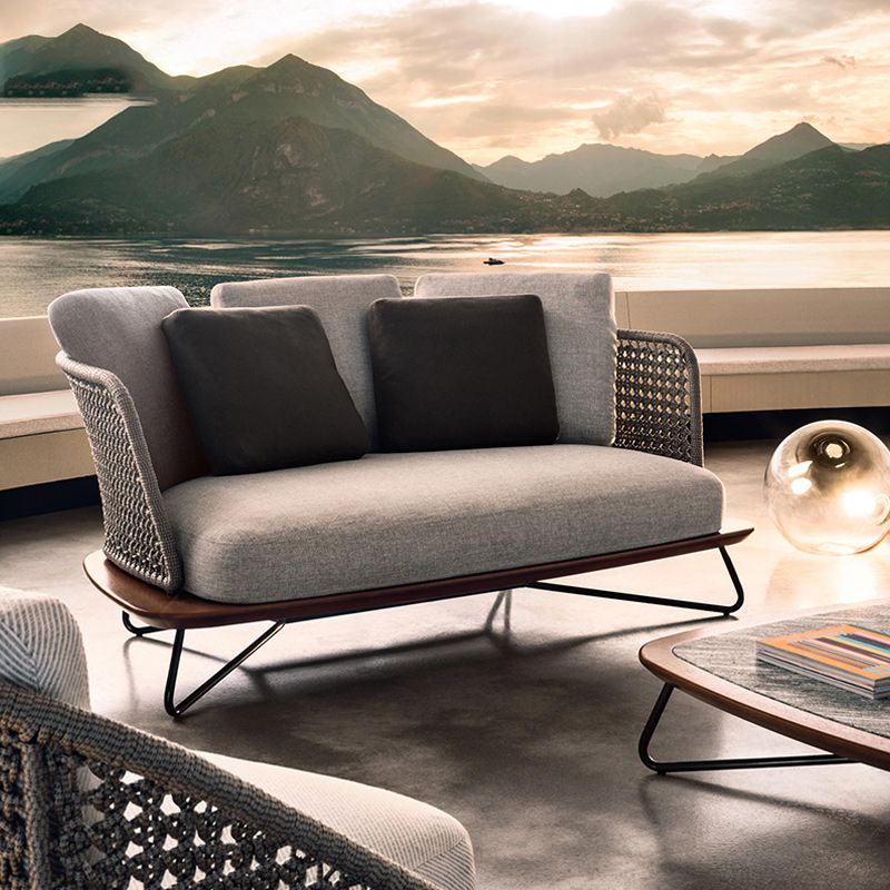 Rattan Outdoor Patio Sofa UV Resistant Tropical Patio Sofa with Cushions