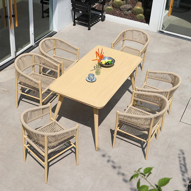 Contemporary Natural Patio Dining Side Chair with Faux Rattan Back