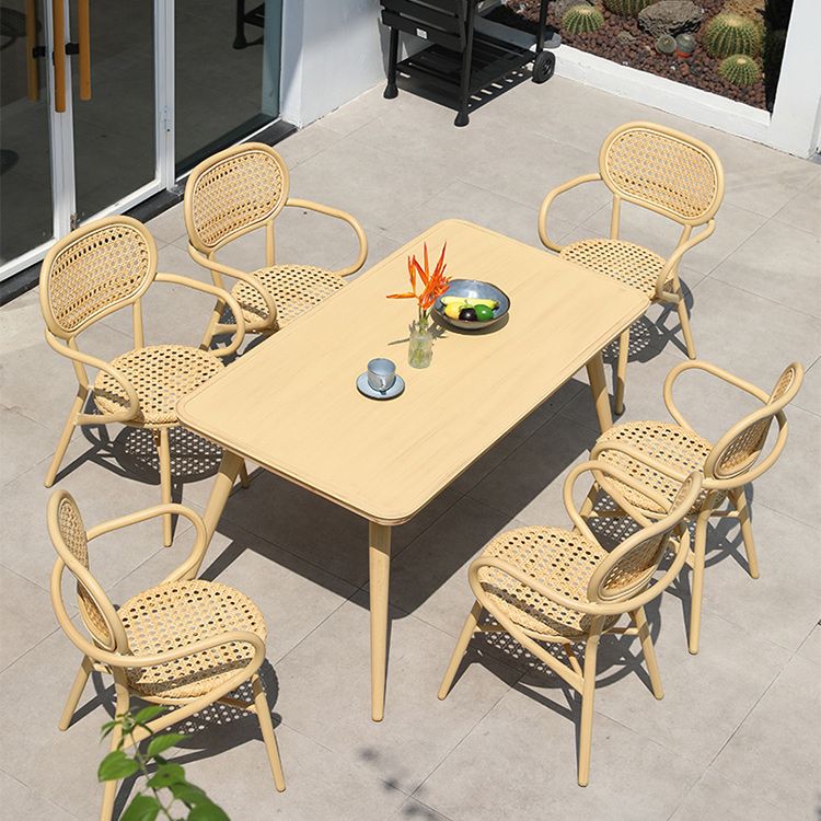 Contemporary Natural Patio Dining Side Chair with Faux Rattan Back